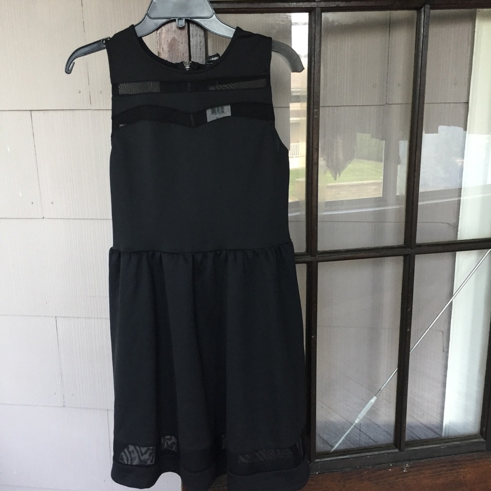 Black and sheer sleeveless skater dress